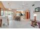 Open kitchen and dining area with stainless steel appliances, tile floors and access to screened area at 5875 Jackson, Venice, FL 34293