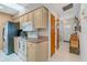 Modern kitchen with stainless steel appliances, tile flooring, light cabinetry and skylight at 5875 Jackson, Venice, FL 34293