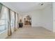 Bright living room features vaulted ceilings, a ceiling fan, and light-colored, wood-look floors at 5875 Jackson, Venice, FL 34293