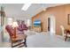 Cozy living room with high ceilings, skylight, tile floors, and comfortable seating arrangement at 5875 Jackson, Venice, FL 34293