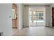 Bright room with tile flooring, leading to a screened pool area through sliding glass doors at 5875 Jackson, Venice, FL 34293