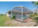 Backyard pool area with a screened enclosure at 5875 Jackson, Venice, FL 34293