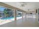 Spacious screened-in patio with a swimming pool and comfortable seating area at 5875 Jackson, Venice, FL 34293