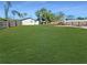 Spacious, fully fenced backyard offers privacy and plenty of room for activities at 605 Cumberland Rd, Venice, FL 34293