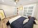 Cozy bedroom with sleek floors, closet, and a ceiling fan at 605 Cumberland Rd, Venice, FL 34293