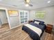 Cozy bedroom with sleek floors, closet, and a ceiling fan at 605 Cumberland Rd, Venice, FL 34293