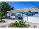 Exterior view of the South Venice Beach Ferry building near lush landscaping and clear blue skies at 605 Cumberland Rd, Venice, FL 34293