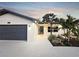Well lit charming single-story home with a well maintained lawn and beautiful landscaping at 605 Cumberland Rd, Venice, FL 34293