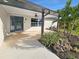 Welcoming front porch with stylish tile and tasteful landscaping, creating curb appeal at 605 Cumberland Rd, Venice, FL 34293