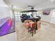 Garage interior featuring custom cabinets, epoxy floors, transparent garage door, and golf cart at 605 Cumberland Rd, Venice, FL 34293