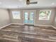 Light-filled living room with sliding glass doors to the backyard at 605 Cumberland Rd, Venice, FL 34293