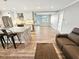 Bright, open living space with a modern kitchen island, hardwood floors, and comfortable seating at 605 Cumberland Rd, Venice, FL 34293