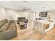 Living room with sleek floors, an open concept to kitchen and comfortable seating at 605 Cumberland Rd, Venice, FL 34293