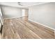 Spacious living room with wood-look floors and neutral paint at 605 Cumberland Rd, Venice, FL 34293