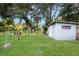 The property features a light-blue shed and fenced backyard for recreational activities or storage at 651 Percheron Cir, Nokomis, FL 34275