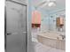 Bathroom featuring white tile, a tub, and a separate shower at 651 Percheron Cir, Nokomis, FL 34275