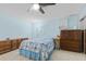 Bedroom with tile floor, ceiling fan, natural light, and a dresser at 651 Percheron Cir, Nokomis, FL 34275