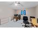 Bedroom with tile floor, ceiling fan, desk, and a built in bookshelf at 651 Percheron Cir, Nokomis, FL 34275