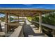 Covered boardwalk provides easy beach access with benches and views of the surrounding landscape at 651 Percheron Cir, Nokomis, FL 34275