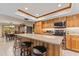 Updated kitchen featuring stainless steel appliances, gorgeous countertops, and wooden cabinets at 651 Percheron Cir, Nokomis, FL 34275