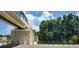 Legacy Trail overpass with pedestrian access, featuring safety fencing, stairs, and lush green trees at 651 Percheron Cir, Nokomis, FL 34275