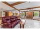 Bright living room with tile flooring, ceiling fan, and views of the modern kitchen and dining area at 651 Percheron Cir, Nokomis, FL 34275