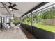 Covered porch with outdoor seating overlooking backyard at 651 Percheron Cir, Nokomis, FL 34275