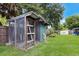 Lawn irrigation and a wood and metal shed add to this property's functionality and curb appeal at 651 Percheron Cir, Nokomis, FL 34275