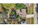 Aerial view showing the roof and backyard featuring screened lanai and pool at 742 Golf Dr, Venice, FL 34285