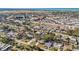 Aerial view captures a residential neighborhood, close to airport, surrounded by lush greenery and local services at 742 Golf Dr, Venice, FL 34285