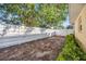Spacious backyard area featuring a white privacy fence, ready for landscaping and outdoor enjoyment at 742 Golf Dr, Venice, FL 34285