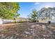 Spacious backyard with a shed and mature landscaping at 742 Golf Dr, Venice, FL 34285