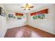 Bedroom with wood laminate floors, natural lighting, and simple decor at 742 Golf Dr, Venice, FL 34285