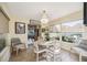 Inviting dining area features a round table, chandelier and view of the outdoors at 742 Golf Dr, Venice, FL 34285