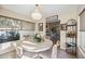 Charming dining area illuminated by a chandelier, adjacent to the open-concept living space at 742 Golf Dr, Venice, FL 34285