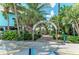Entrance to the Venice Fishing Pier framed by palm trees and lush tropical vegetation at 742 Golf Dr, Venice, FL 34285