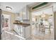 Bright kitchen featuring white cabinets, granite countertops, and stainless steel appliances at 742 Golf Dr, Venice, FL 34285
