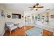 Inviting living room showcases wood-look floors, comfortable seating, decorative accents, and an entertainment center at 742 Golf Dr, Venice, FL 34285