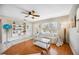 Comfortable living room featuring stylish furniture, built-in shelving, and a bright window with natural light at 742 Golf Dr, Venice, FL 34285