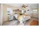 Comfortable bedroom with a ceiling fan and windows, furnished with neutral decor at 742 Golf Dr, Venice, FL 34285