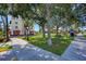 Serene park scene with mature trees offering shade, park benches, and bicycle parking at 742 Golf Dr, Venice, FL 34285