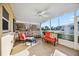 The patio is screened and features seating and pleasant views of the outdoors at 742 Golf Dr, Venice, FL 34285