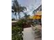 Outdoor patio featuring stylish furniture, a lush garden, and a relaxing shaded area at 742 Golf Dr, Venice, FL 34285