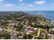 Aerial view of the property, nestled in a neighborhood with water views, lush greenery, and a serene atmosphere at 771 Stewart St, Englewood, FL 34223