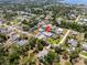 Aerial view showcasing the property, surrounded by lush trees and a tranquil neighborhood near the water at 771 Stewart St, Englewood, FL 34223