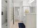 Bathroom featuring a glass block shower and sleek vanity at 771 Stewart St, Englewood, FL 34223