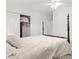 Bright bedroom featuring a comfortable bed and closet with sliding doors at 771 Stewart St, Englewood, FL 34223