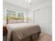 Bright bedroom with neutral tones and large closet at 771 Stewart St, Englewood, FL 34223