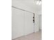 Bedroom closet with sliding doors and organized storage at 771 Stewart St, Englewood, FL 34223