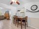 Cozy dining area with a dark wood table situated near a window at 771 Stewart St, Englewood, FL 34223